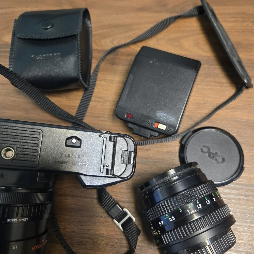 Canon Black SLR Camera with Textured Zoom Lens